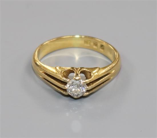 A 1930s 18ct gold and claw set solitaire diamond ring, size K.
